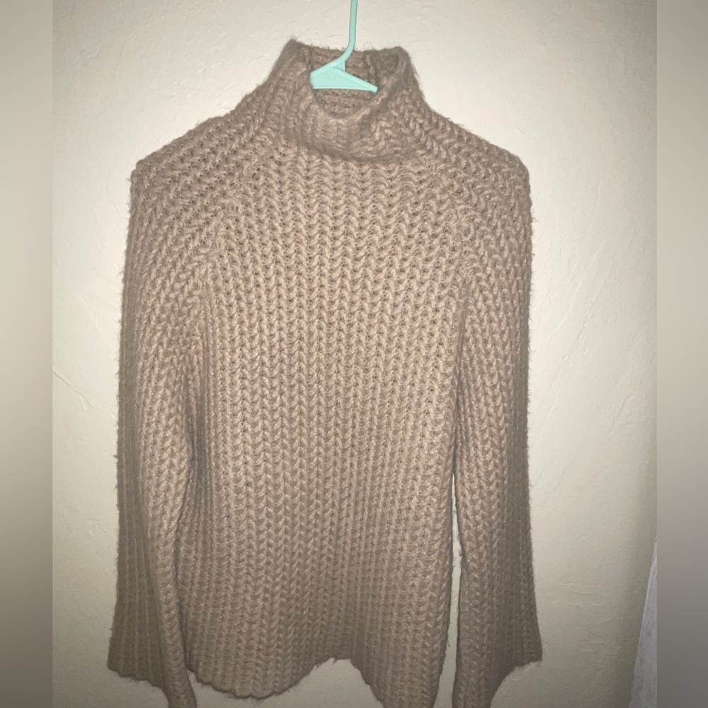 Tan sweater-thick turtle neck style
